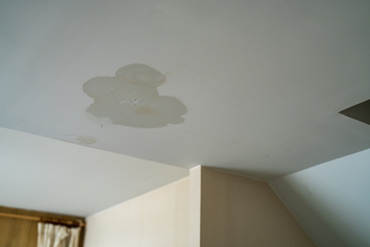 Water-stained ceiling drywall below a roof leak
